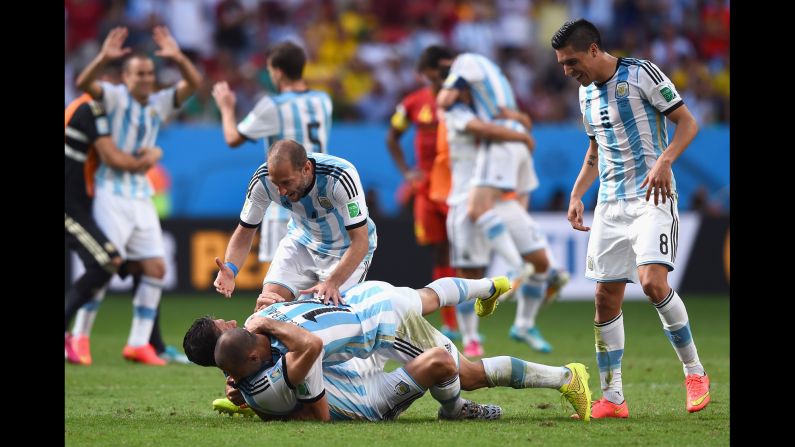 Martin Demichelis, left, Javier Mascherano, Pablo Zabaleta and Enzo Perez of Argentina celebrate their win.