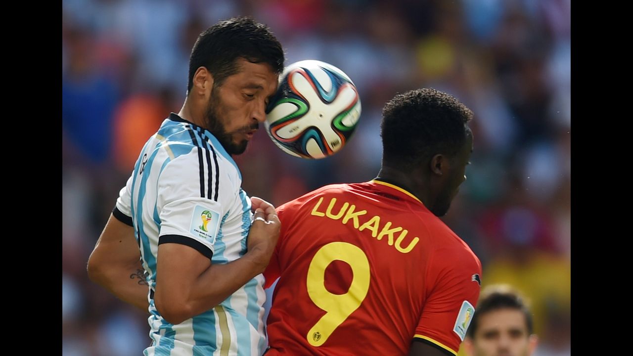 Argentina's defender Ezequiel Garay, left, vies with Belgium's forward Romelu Lukaku. 