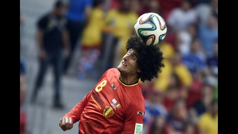 Belgium midfielder Marouane Fellaini heads the ball. 