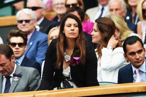 Nearby, reigning champion (although not for long) Marion Bartoli casts her eyes across proceedings.