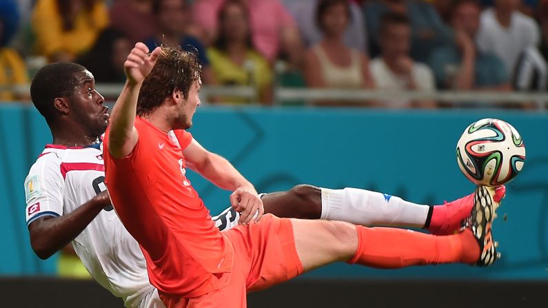 Costa Rica forward Joel Campbell, left, vies with Netherlands defender Daley Blind.