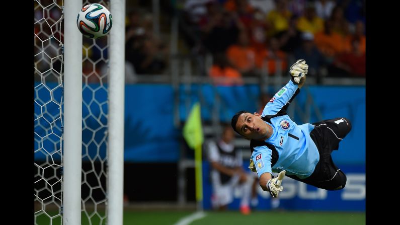 Costa Rica goalkeeper Keylor Navas dives for the ball. 