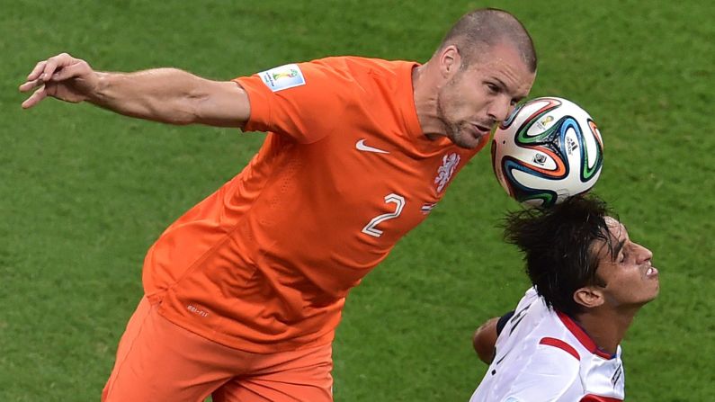 Netherlands' defender Ron Vlaar, left, vies with Costa Rica's forward and captain Bryan Ruiz. 