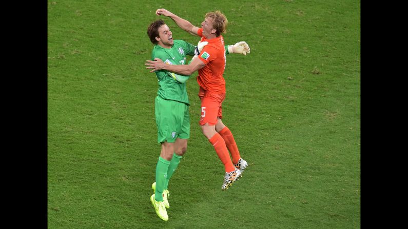 Netherlands' substitute goalkeeper Tim Krul, left, celebrates with defender Dirk Kuyt after the victory. Krul was the hero after saving two penalties to secure a 4-3 win in Salvador, Brazil.