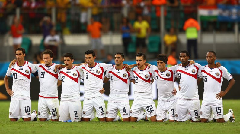 Costa Rica players line up for a penalty shootout after extra time ended with no score.