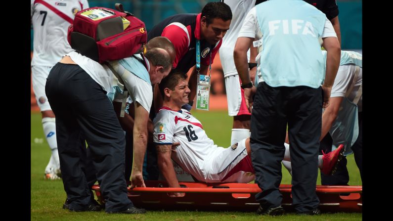 Costa Rica defender Cristian Gamboa is taken out on a stretcher after an injury.