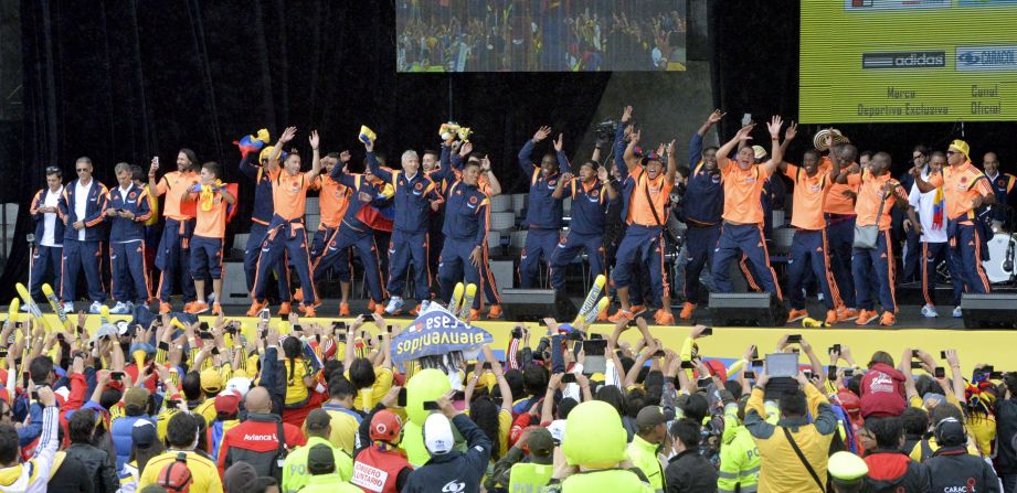 The Colombian squad shows off its dancing skills as it is paraded in front of its adoring fans. 