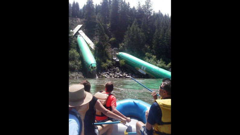Rafters pass the fuselages as they go down the Clark Fork River near a section called Mermaid Rock.