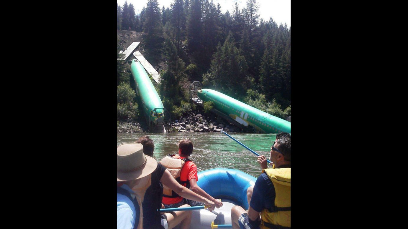 Rafters pass the fuselages as they go down the Clark Fork River near a section called Mermaid Rock.