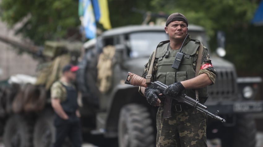 A Ukrainian soldier guards at a security building in Slovyansk, eastern Ukraine, Sunday, July 6, 2014.