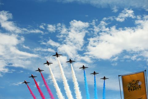 The first stage of the tour between Leeds and Harrogate kicked off in style with The Red Arrows of the RAF flying overhead.