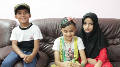 Six-year-old Ali, left, who lost his father in a bomb attack in Sadr City, sits alongside sister Baneen, center, 11, and Baneen's friend Hajer, 11, whose father was assassinated when she was only four years old.