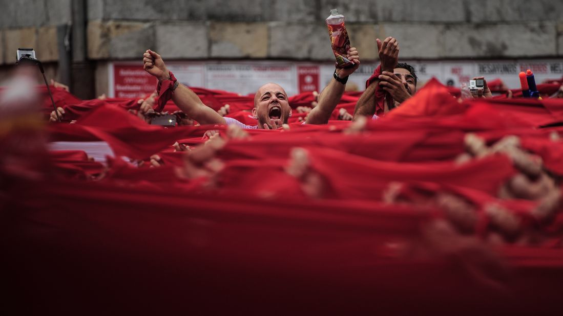 Revelers kick off the San Fermin festival with a messy party in Pamplona's town square on July 6.