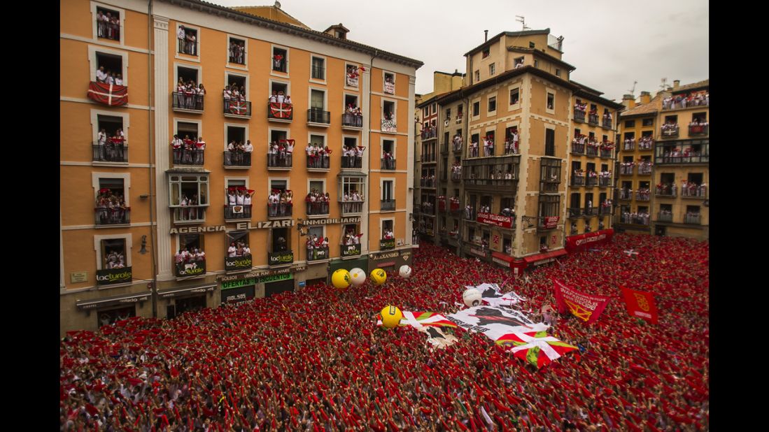 Revelers hold up traditional red neckties during the official opening July 6. 