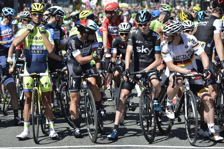 Contador, Mark Cavendish, Chris Froome and Andre Greipel all stand at the front of the pack waiting for the first stage of the Tour to begin. Cavendish's race ended later that day with a crash in Harrogate.