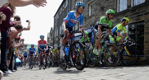 The pack rides up the high street in Haworth, the home of the Bronte sisters, who penned a series of literary masterpieces in the 19th century. 