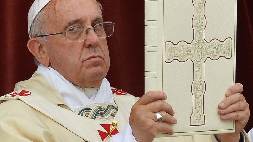 Pope Francis (C) celebrates mass at Saint John's Lateran Basilica in Rome on June 19, 2014, prior to the procession from Saint John's Lateran Basilica to the Basilica of Saint Mary Major to mark the Roman Catholic feast of Corpus Domini commemorating Jesus Christ's last supper and the institution of the eucharist