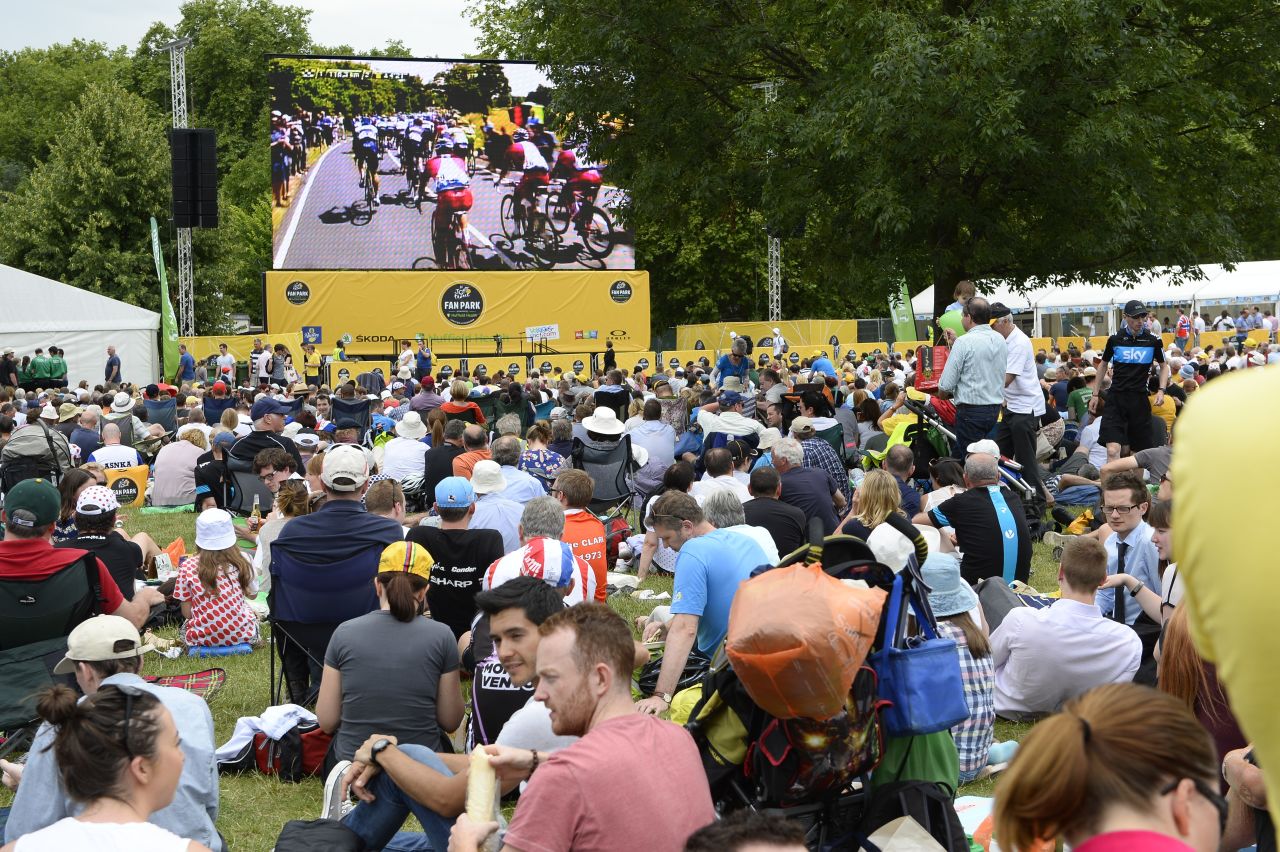 Fans gathered at the 'Fan Park' in Green Park look at a  giant screen as the 155 km third stage takes place. The third stage began in Cambridge and ended in London. 