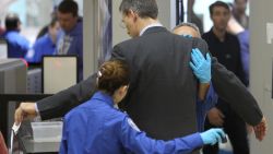 An air traveler is patted down after passing through a full-body scanner at Los Angeles International Airport (LAX) on February 20, 2014 in Los Angeles, California. 