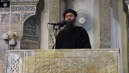An image grab taken from a propaganda video released on July 5, 2014 by al-Furqan Media allegedly shows the leader of the Islamic State (IS) jihadist group, Abu Bakr al-Baghdadi, aka Caliph Ibrahim, adressing Muslim worshippers at a mosque in the militant-held northern Iraqi city of Mosul. Baghdadi, who on June 29 proclaimed a "caliphate" straddling Syria and Iraq, purportedly ordered all Muslims to obey him in the video released on social media.