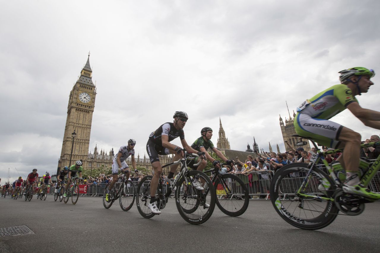 The crowds cheer on as the cyclists pass through Parliament Square and the Big Ben on their tour through London. 