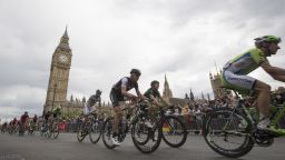 The crowds cheer on as the cyclists pass through Parliament Square and the Big Ben in their tour through London.