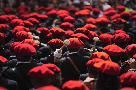 Musicians wearing traditional red berets play during the official opening on July 6. 