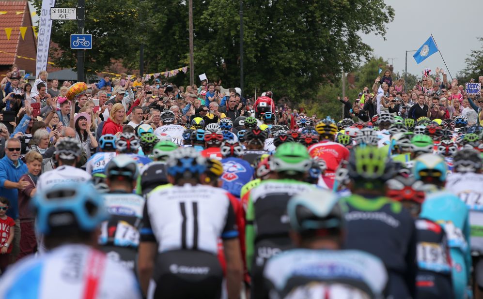 Tour de France stars get up close and personal with spectators on the opening stage in Yorkshire but they have complained about fans taking 'selfies' and not paying attention to the risk they pose to the riders.   