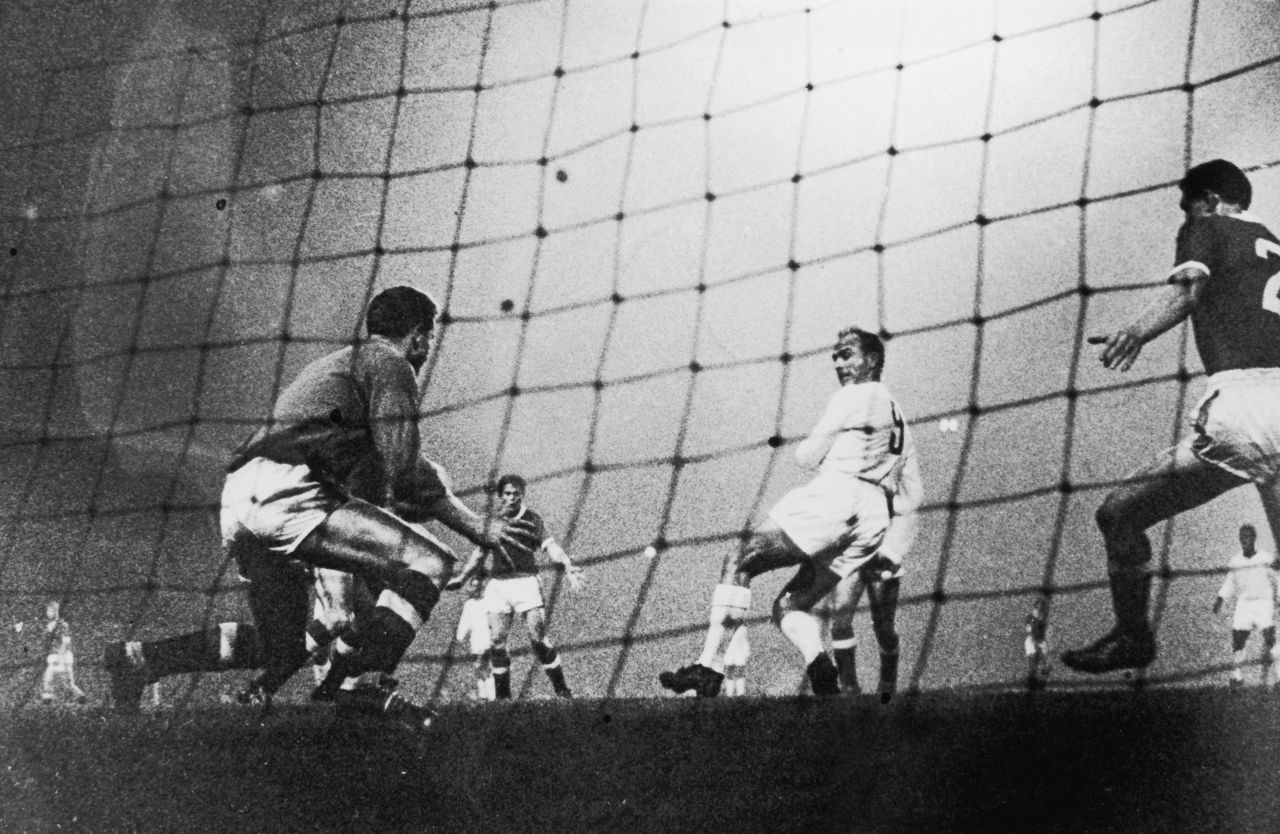 Di Stefano, who was born in Buenos Aires and uniquely played for the Argentinian, Colombian, and Spanish national teams, backheels the ball past the Manchester United goalkeeper on October 2, 1959.