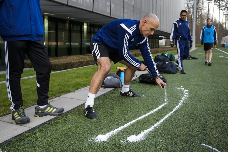Here English referee Howard Webb tries the vanishing spray during a seminar for 2014 FIFA World Cup referees on March 27, 2014 at the home of FIFA in Zurich.