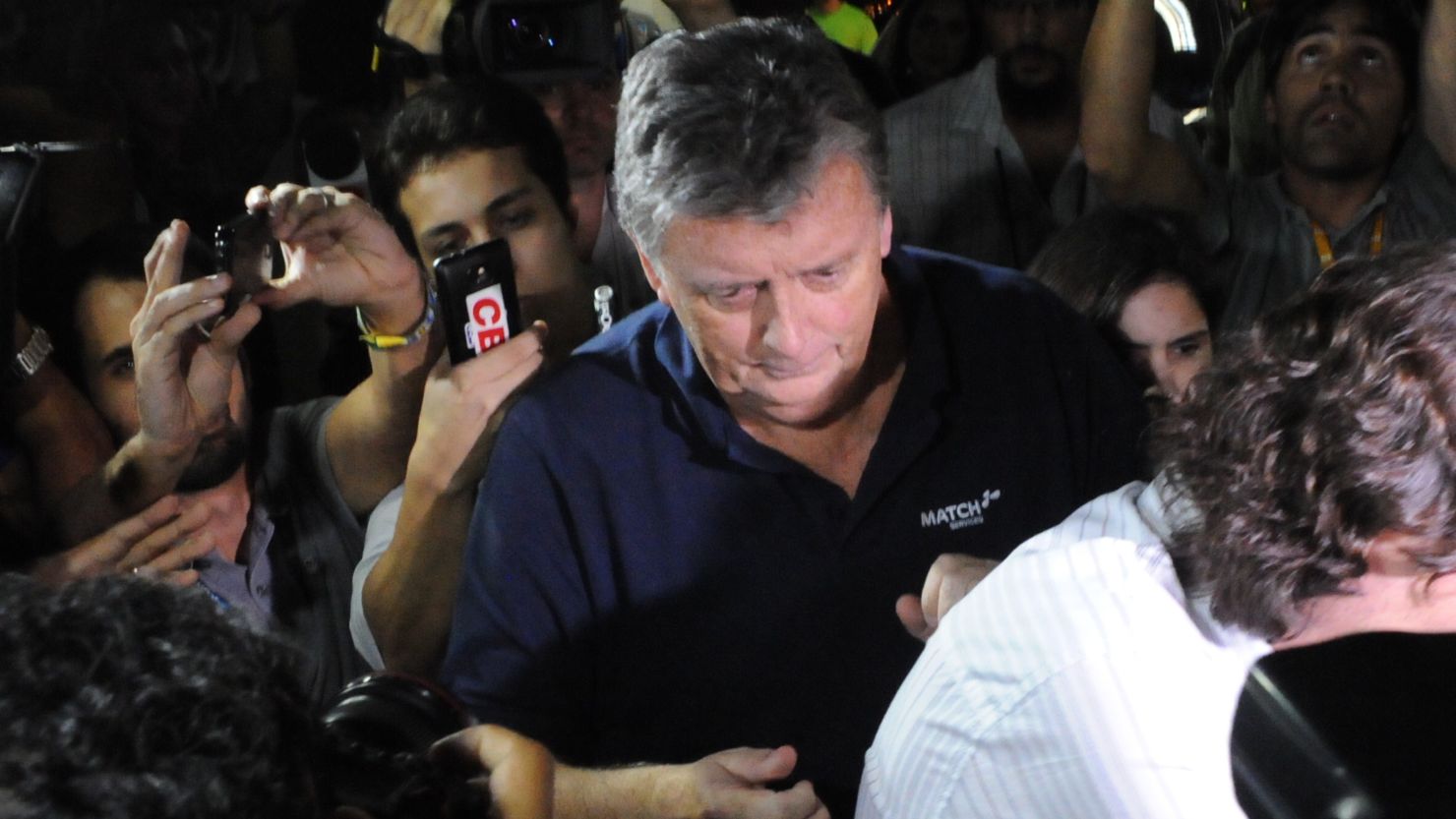 Raymond Whelan arrives at a police station in Brazil after being arrested as part of a probe into illegal World Cup ticket sales.