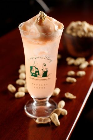 The Makati Sling, a pinkish version of the Singapore Sling, is a lime- and pineapple-juice concoction with Tanqueray Ten gin, cherry blossom, Grand Marnier and Benedictine with Angostura bitters whipped into foam and topped with 24k gold flakes ... and served in a Singapore Sling glass!