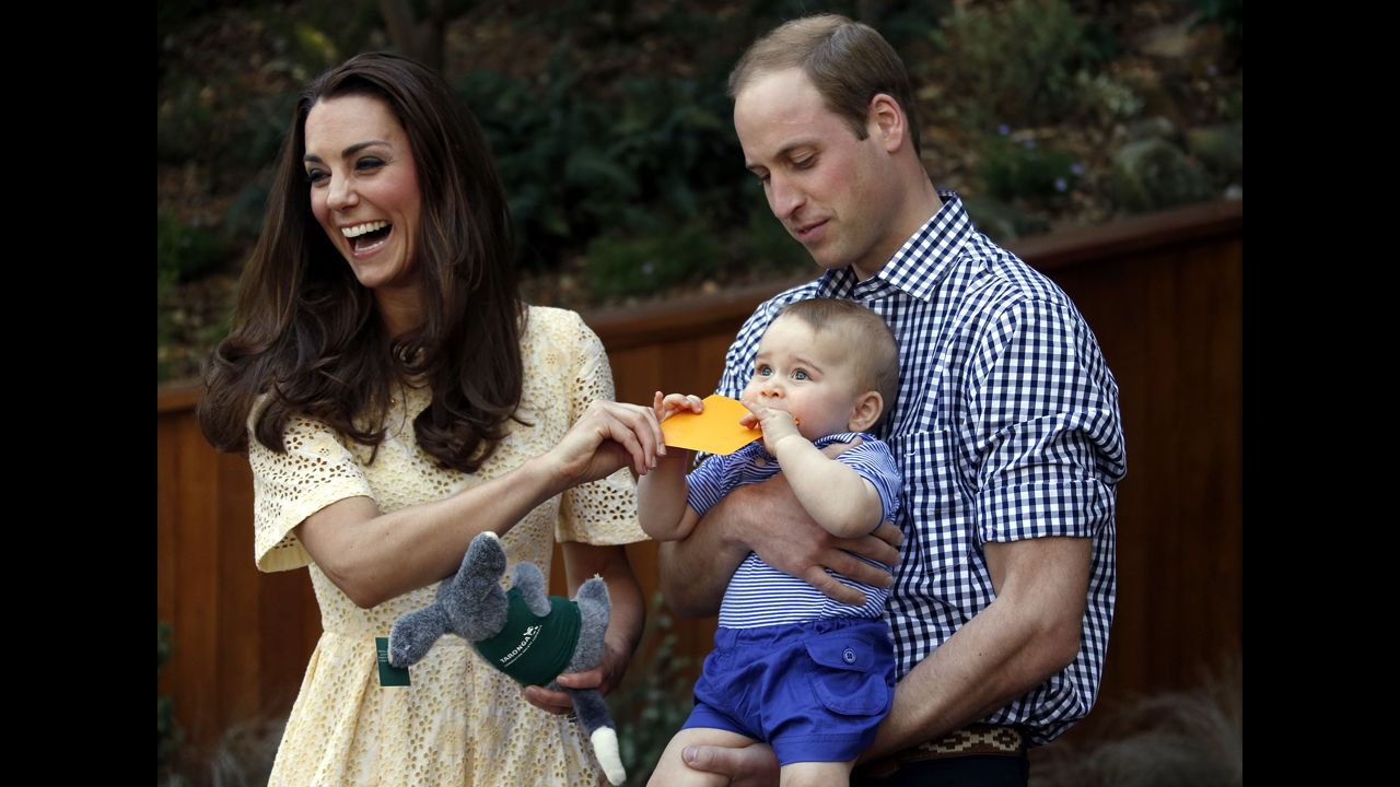 Catherine and William react as their son bites a small present at the bilby enclosure of Sydney's Taronga Zoo on April 20. One of the zoo's bilbies was renamed George in honor of the young prince.