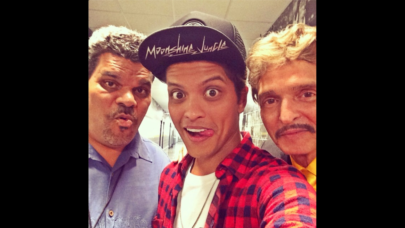 Pop star Bruno Mars, center, <a href="http://instagram.com/p/p-dxF_u82N/" target="_blank" target="_blank">posted this selfie</a> of him with his father, right, and actor Luis Guzman on Thursday, July 3. "Luis, and Pops tonight #Boston," he wrote on his Instagram account.