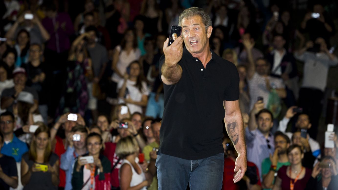 Actor Mel Gibson snaps a selfie Friday, July 4, in front of fans at the Karlovy Vary International Film Festival in Karlovy Vary, Czech Republic. Gibson was putting on an outdoor screening of his classic film "Mad Max."