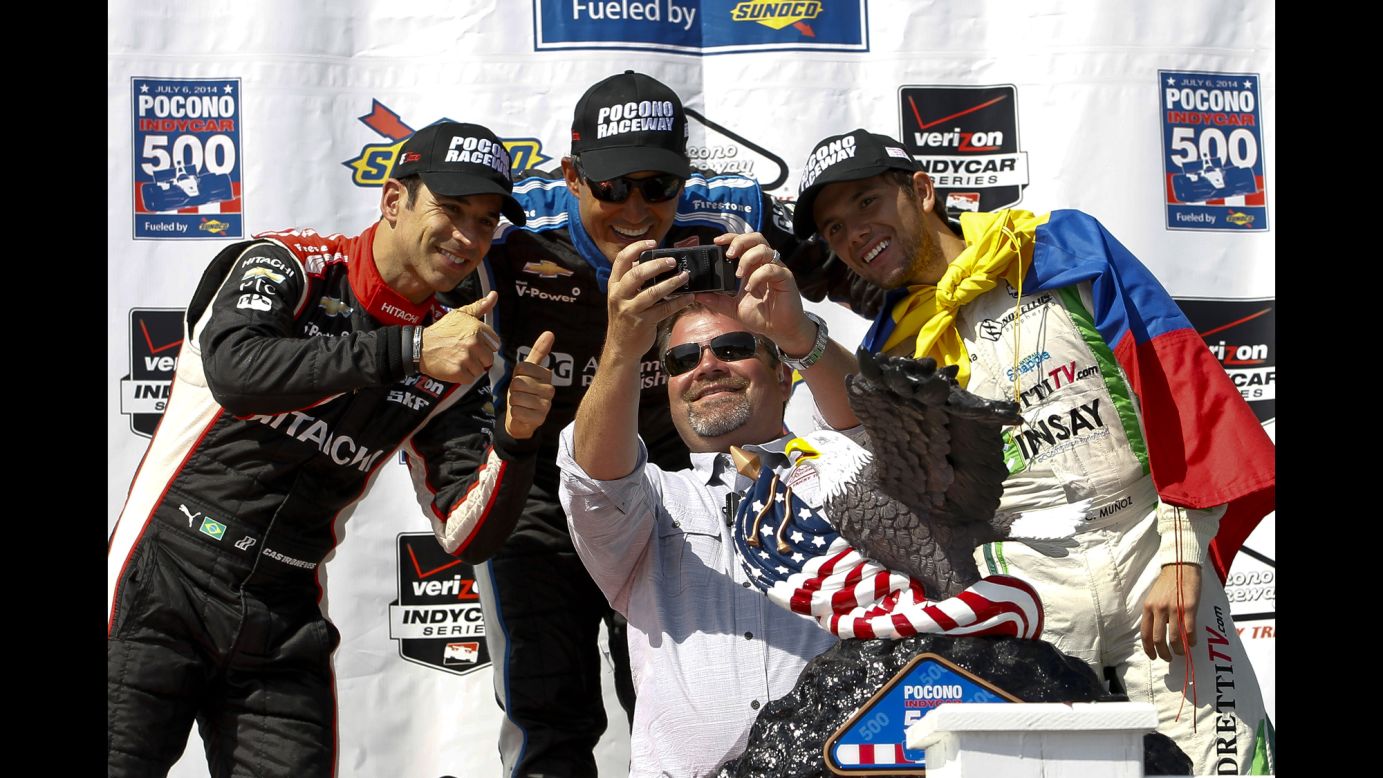 Brandon Igdalsky, the president of Pocono International Raceway, snaps a selfie with three IndyCar drivers Sunday, July 6, at the Pocono IndyCar 500 in Long Pond, Pennsylvania. Behind Igdalsky, from left, are drivers Helio Castroneves, Juan Pablo Montoya and Carlos Huertas.