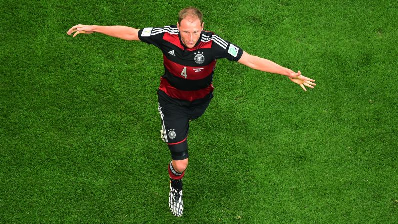 Benedikt Hoewedes of Germany celebrates after teammate Thomas Mueller, not pictured, scored the opening goal against Brazil.