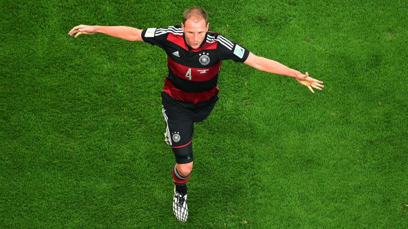 Benedikt Hoewedes of Germany celebrates after teammate Thomas Mueller, not pictured, scored the opening goal against Brazil. 