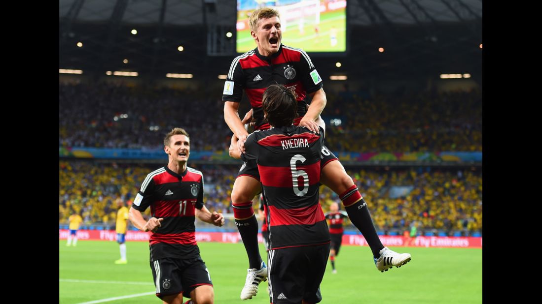 Kroos is lifted in the air by teammate Sami Khedira after he scored to put Germany up 3-0.