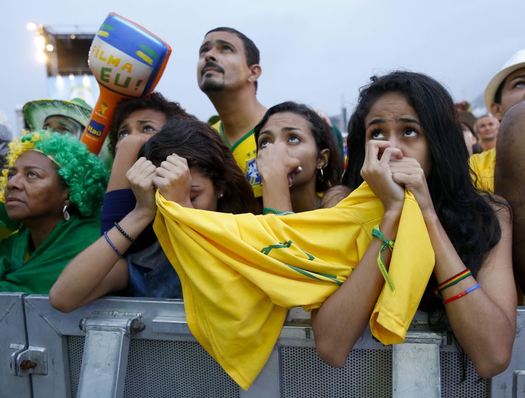 Fans of Brazil react while watching the match at Copacabana beach in Rio De Janeiro.
