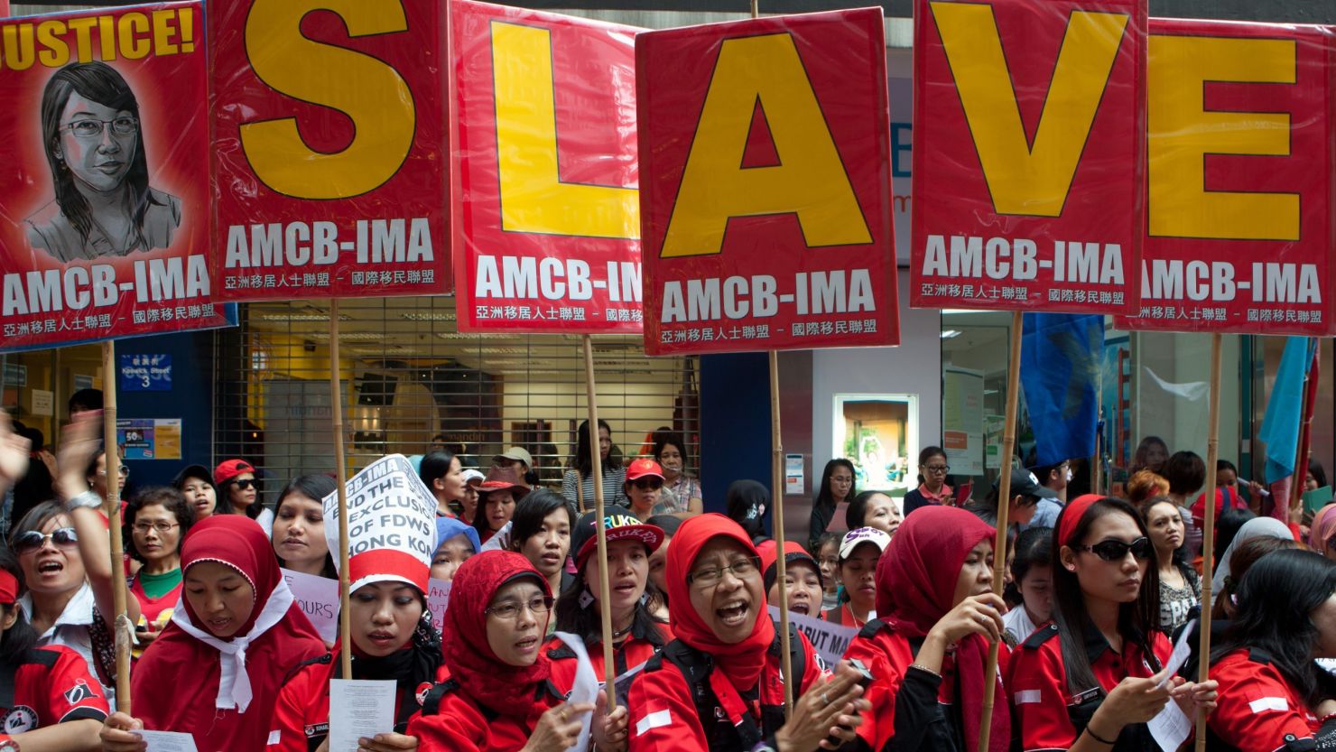 Migrant workers from Indonesia protest against modern slavery during a Labour Day rally in Hong Kong on May 1, 2014. 