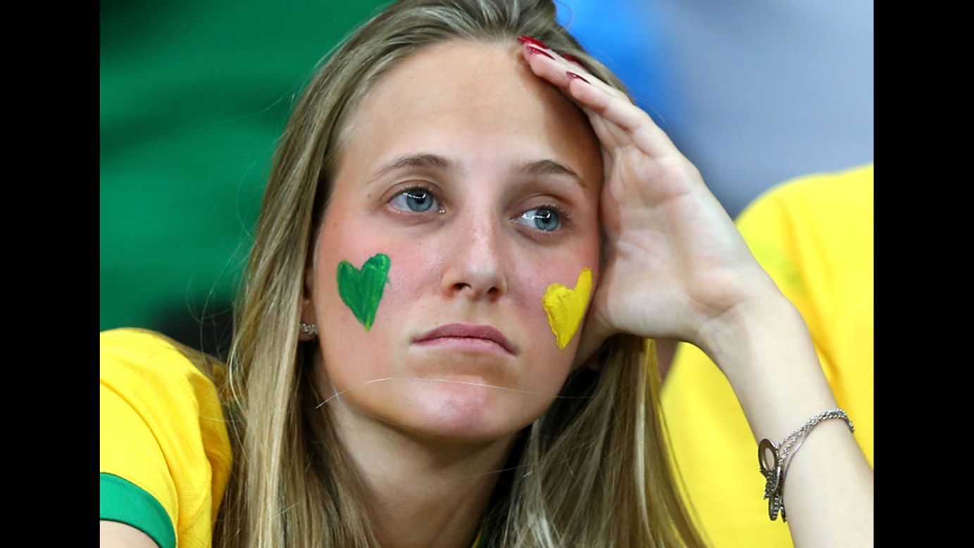 A Brazil fan looks on in the first half.