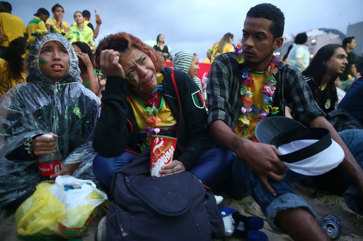 Brazil fans in Rio de Janeiro appear devastated as they watch a live telecast of the match.