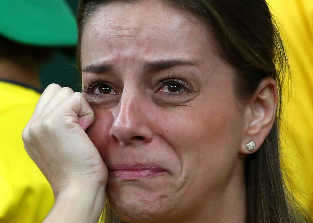A dejected Brazil fan looks on during the match.