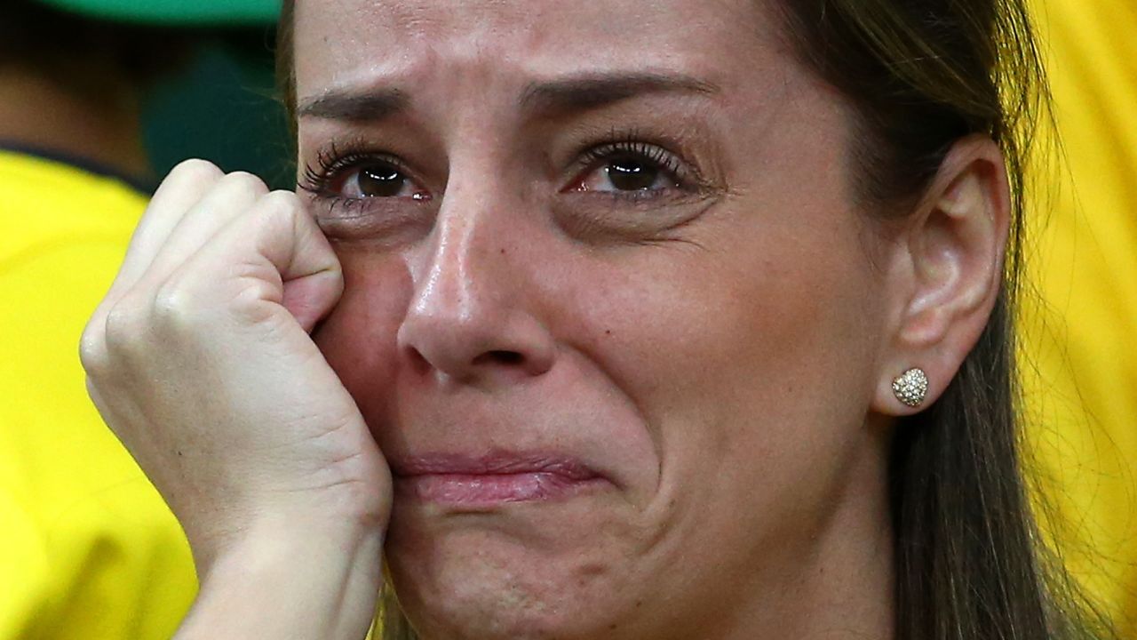 A dejected Brazil fan looks on during the 2014 FIFA World Cup Brazil Semi Final match between Brazil and Germany at Estadio Mineirao on July 8, 2014 in Belo Horizonte, Brazil.