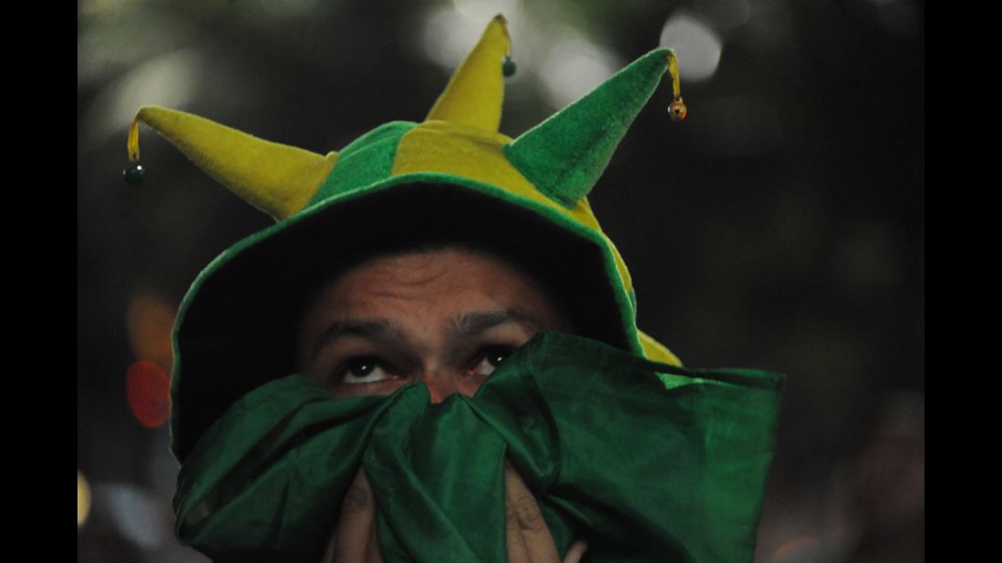 A Brazil fan watches the match on television in Rio de Janeiro.