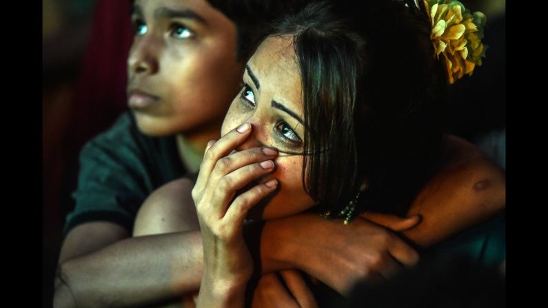 Brazil supporters watch their team play against Germany during a public viewing of the World Cup semifinal Tuesday, July 8, in Rio de Janeiro. 