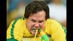 A Brazil fan reacts after the Brazilian national team lost to Germany with a final score of 7-1 in Belo Horizonte, Brazil, on Tuesday, July 8.