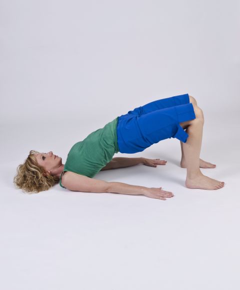 Flowing bridge: Corrects favoring one side of your body over the other and counterbalances quad and hip-flexor dominance.