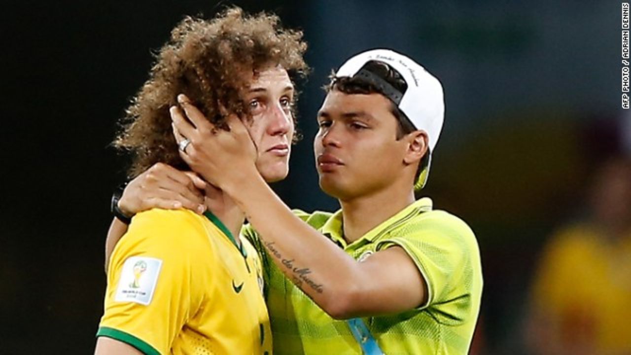 A teary David Luiz of Brazil is comforted by teammate Thiago Silva. - (Getty Images)